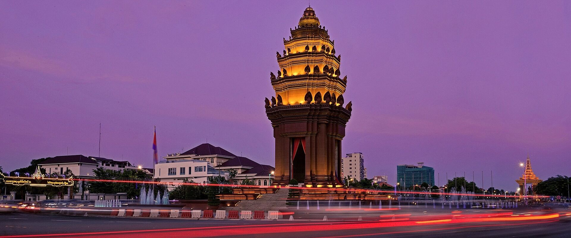 Serene Phnom Penh cityscape in Cambodia on a Phnom Penh Travel banner by Legend Travel Group.